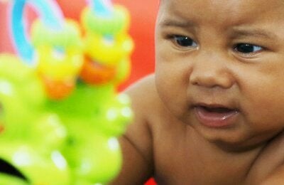 baby playing with toy